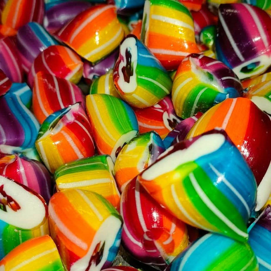 Colorful striped lollipops in a pile