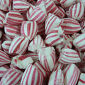 Close-up of red and white striped candy pieces.