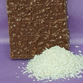 Chocolate bar with a crumbly texture on a purple background